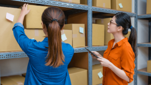 Two women in a storage room - Order Management Workflow
