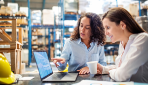 Two women in a warehouse - Supply Chain Order Management