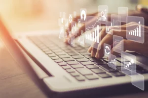 Person Typing on Laptop - Order & Sales Software