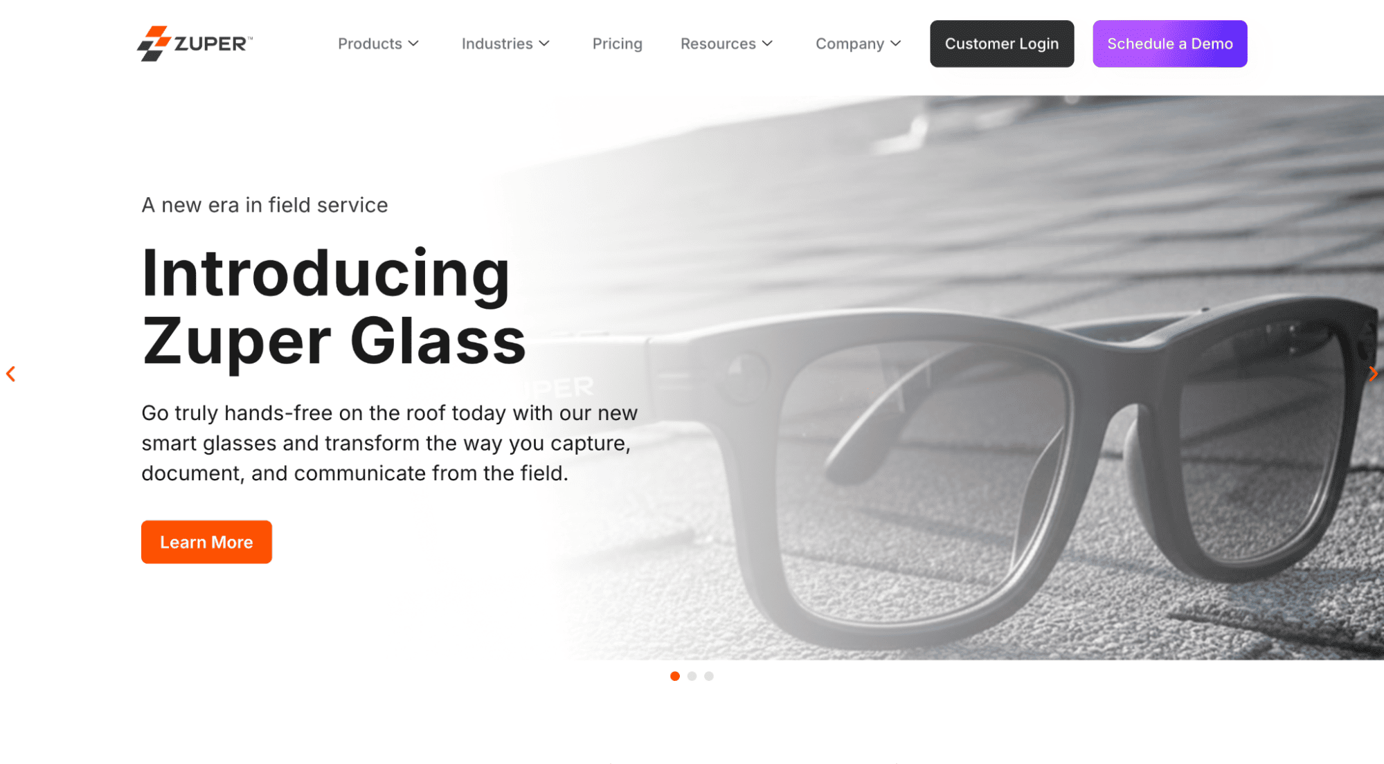 Black smart glasses displayed on a rooftop are featured on the Zuper Glass site, with menus, headlines, text, and a Learn More button.
