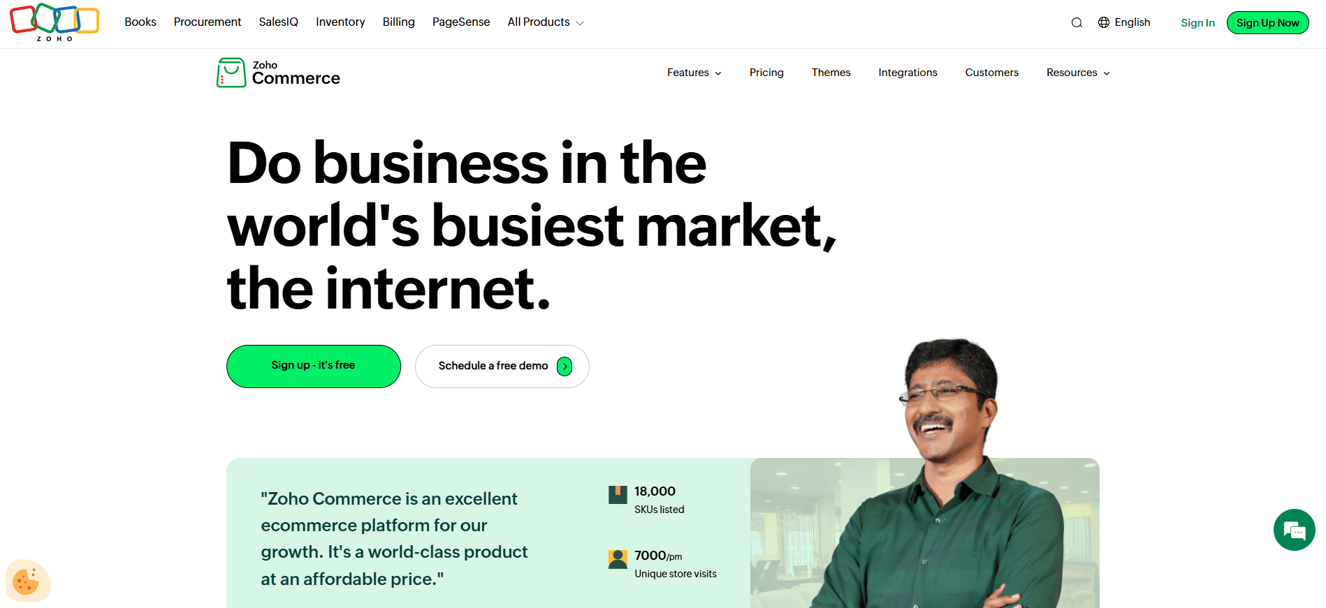 Zoho Commerce webpage with “Do business in the world’s busiest market” headline, green signup buttons, and a smiling man lower right.